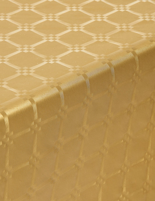 Gros plan sur le motif de la nappe en rouleau papier damassé pour fête doré jetable