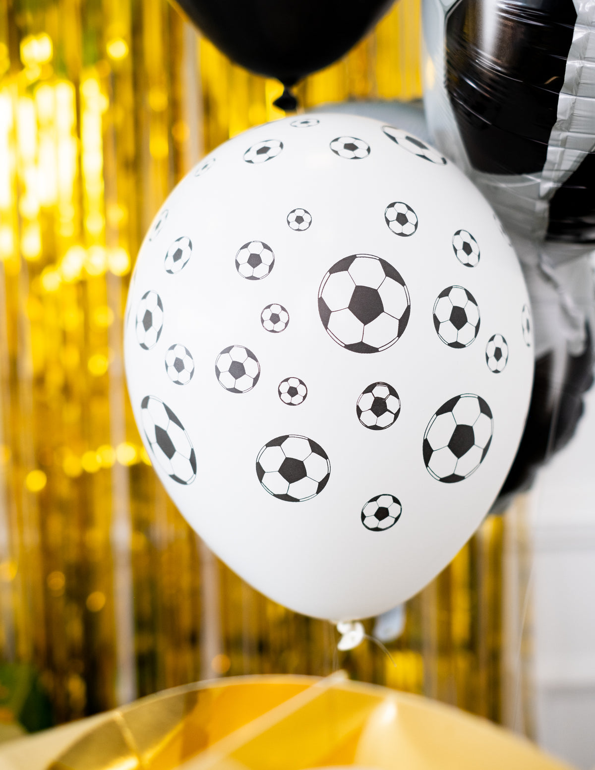 Détail d'un ballon blanc à motifs du ballons latex Foot