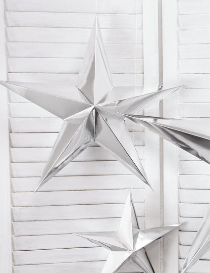 Mise en scène de la décoration à suspendre étoile pour Noël