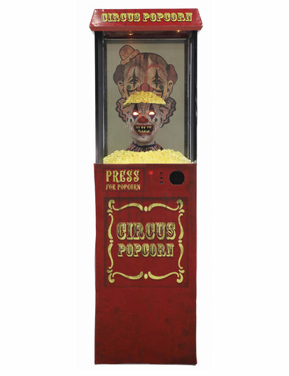 Vue de face de la décoration animée distributeur de pop-corn avec clown effrayant