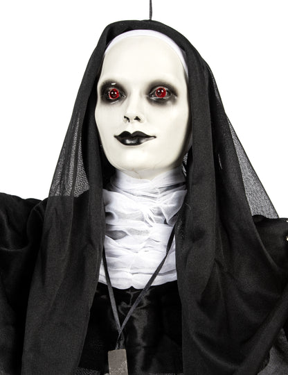 Detaliu al bustului și al feței decorațiunii luminoase de călugăriță suspendată