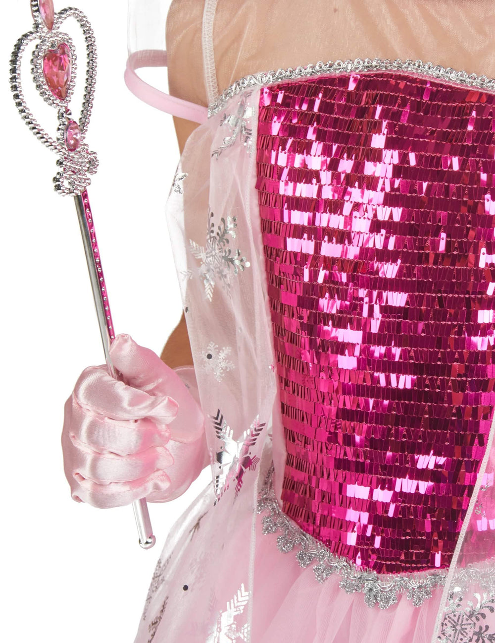 Detaliu al sceptrului și al bustierului cu paiete ale costumului și accesorii de prințesă