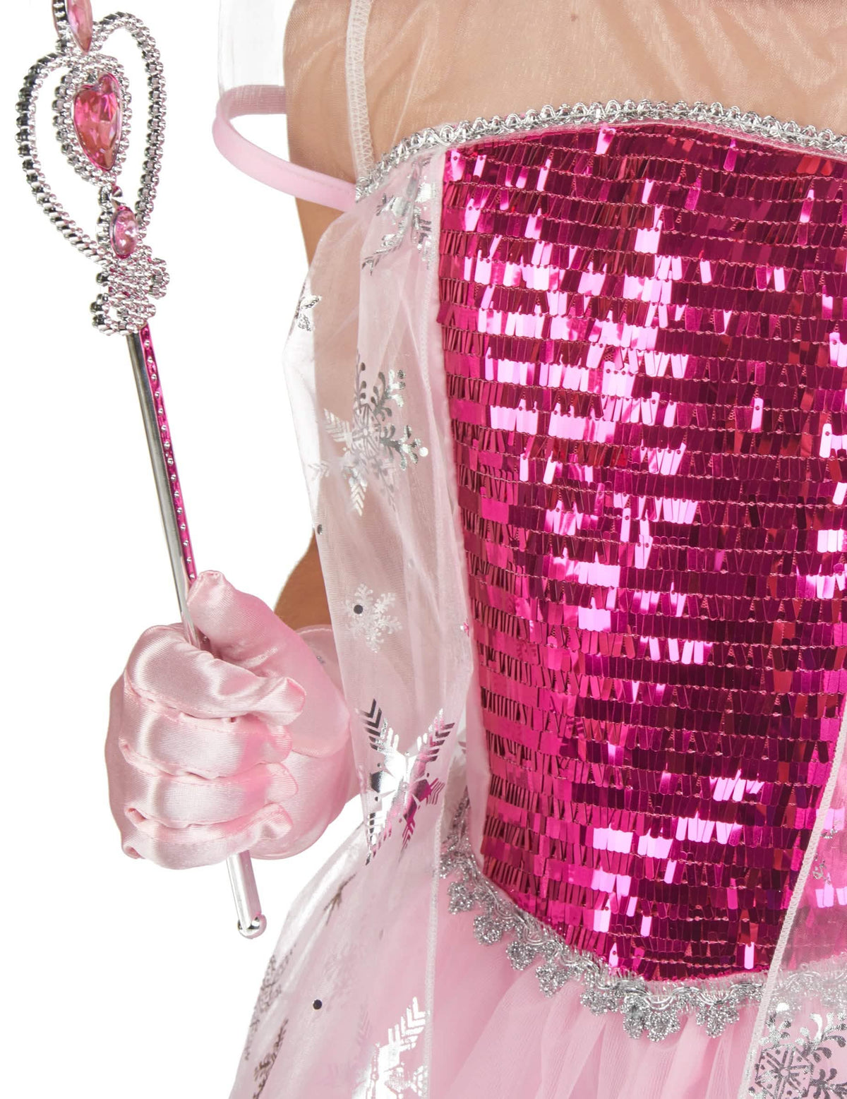 Detaliu al sceptrului și al bustierului cu paiete ale costumului și accesorii de prințesă