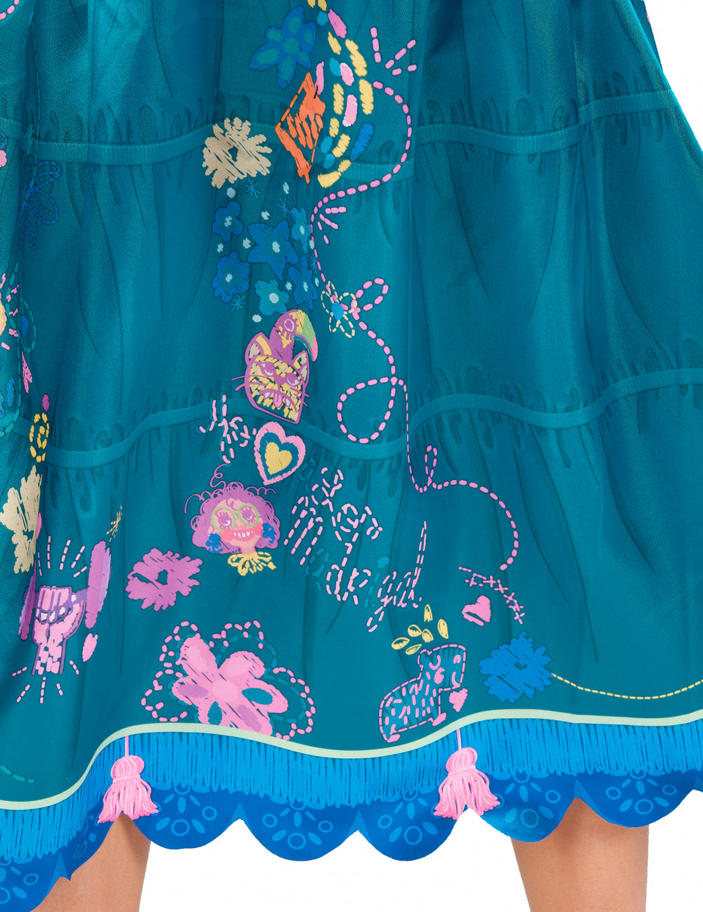 Détail des motifs et des pompons roses du déguisement Mirabel Encanto™ classique