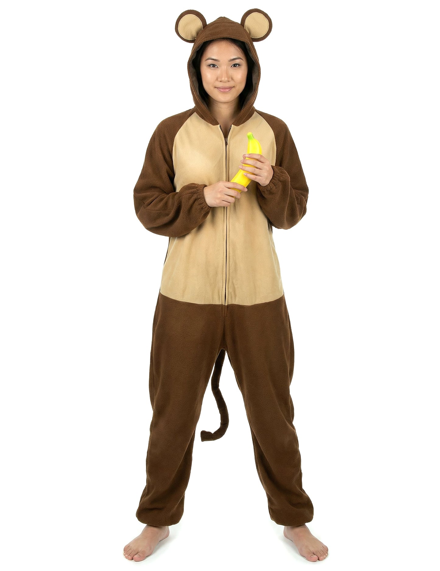 Banane tenue à la main du déguisement de singe