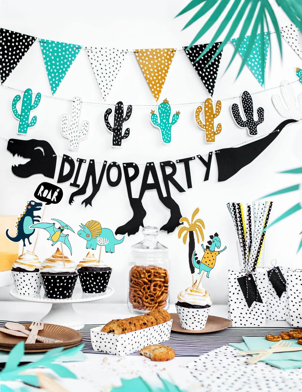 Punere în scenă cu bufet de petrecere cu ghirlanda din carton cu schelet dino party