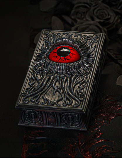 Livre décoratif en résine avec œil rouge sang 20 cm