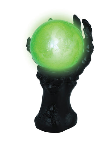 Mână scheletică neagră cu glob de cristal luminos