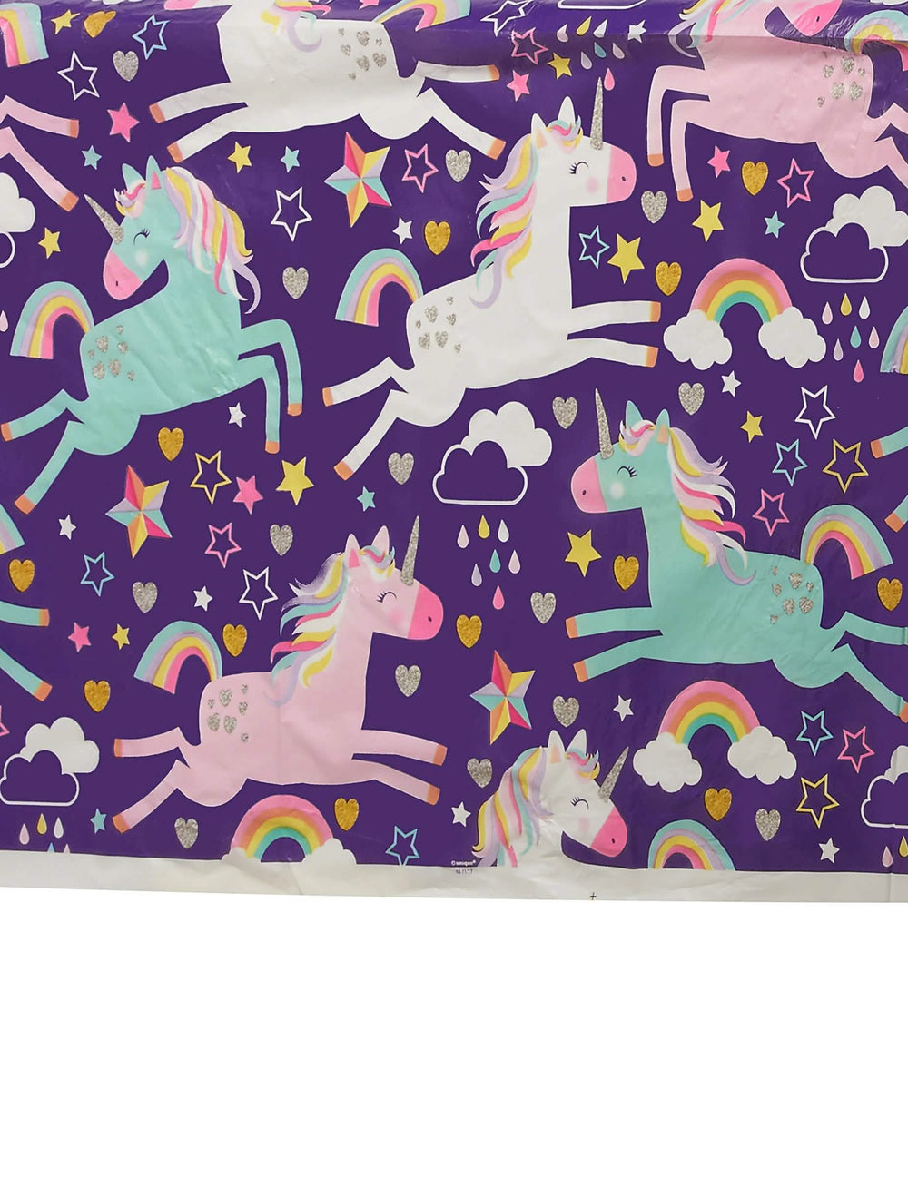 Detaliu al motivelor cu unicorni și curcubeie de pe fața de masă din plastic unicorn party