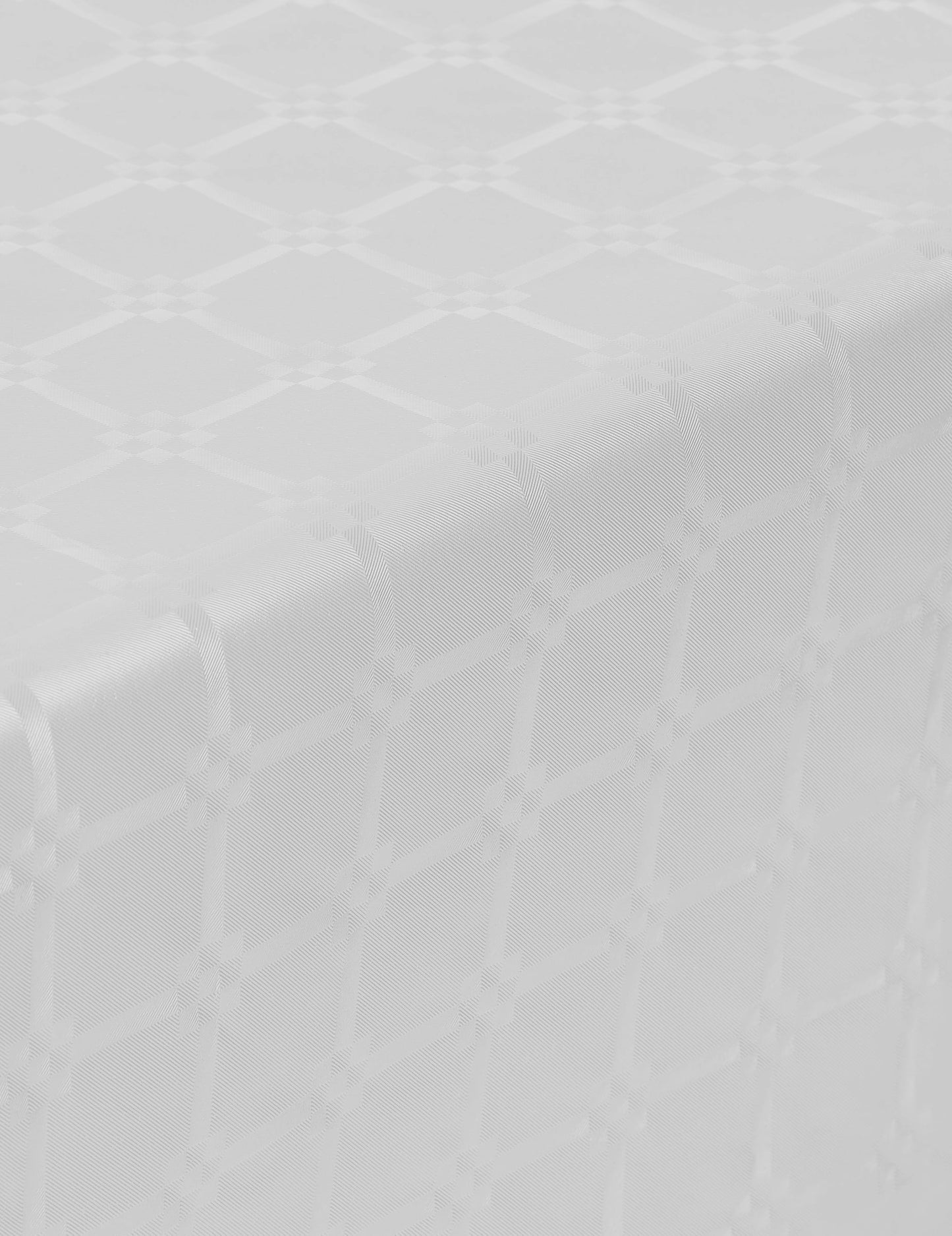 Détail du motif damassé de la nappe en rouleau papier damassé blanche